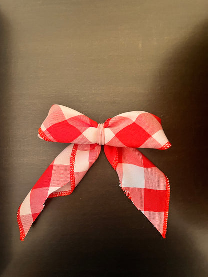 Pink plaid dog bow